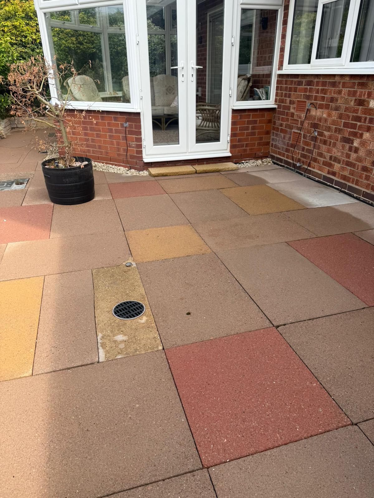 clean coloured patio slabs no moss or algae in front of conservatory