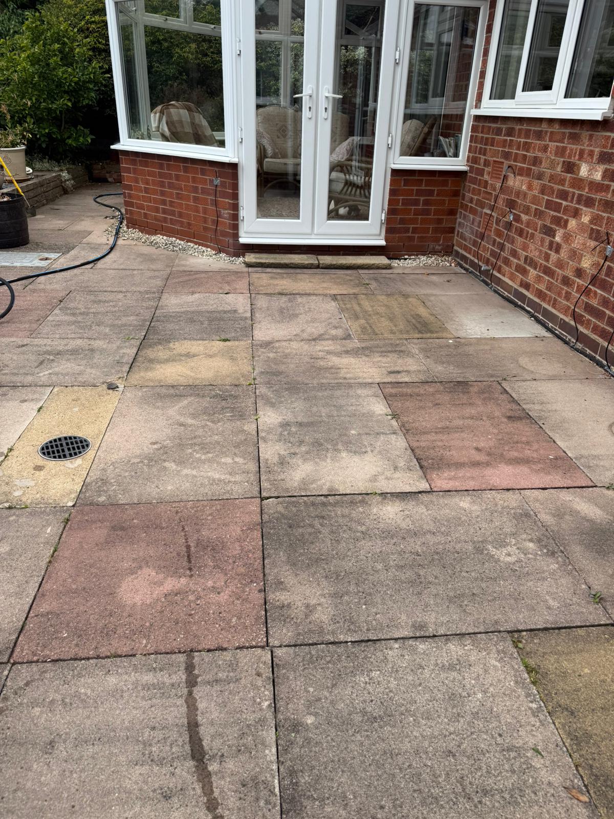 dirty coloured slabs by conservatory